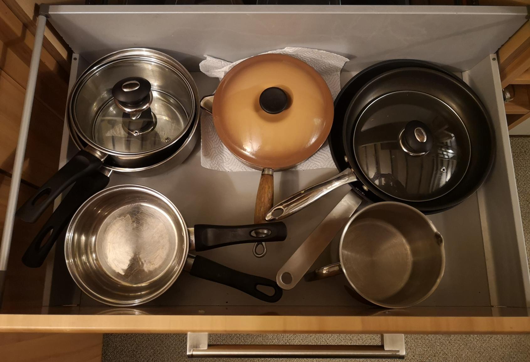 a drawer full of pans